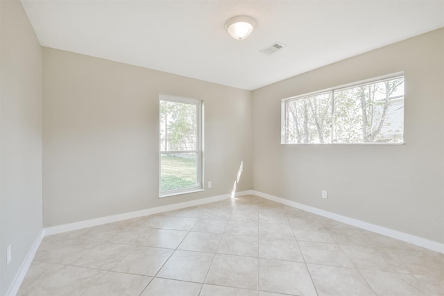 unfurnished room with light tile patterned floors