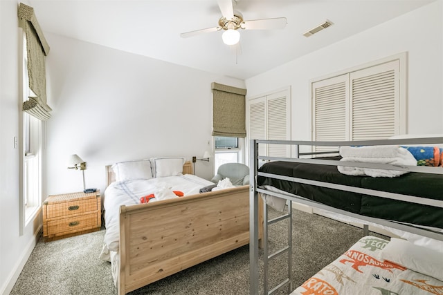 bedroom featuring carpet flooring, multiple windows, a closet, and ceiling fan