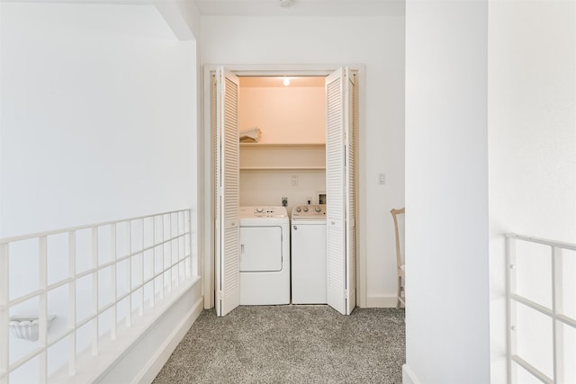 washroom with light carpet and washer and dryer