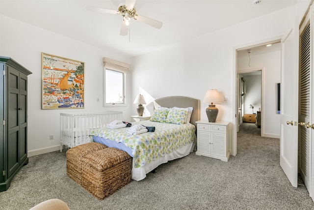 bedroom featuring ceiling fan, light colored carpet, and a closet