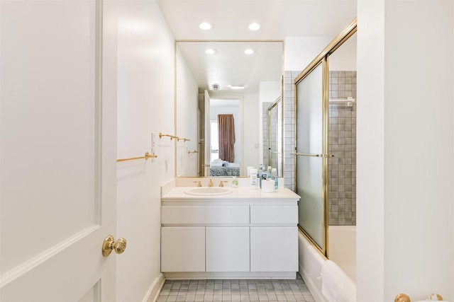 bathroom featuring shower / bath combination with glass door, tile patterned flooring, and vanity