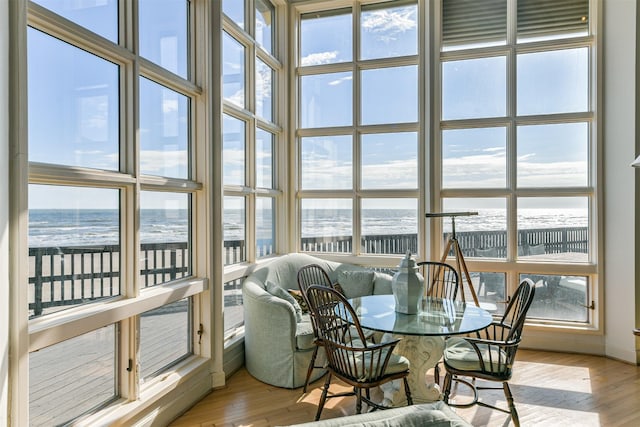 sunroom / solarium with a water view