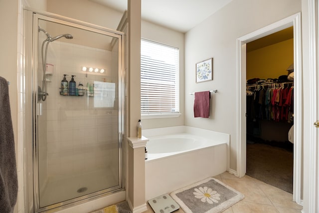 bathroom featuring tile patterned floors and independent shower and bath