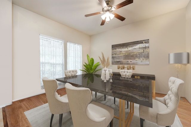 dining space featuring hardwood / wood-style floors and ceiling fan