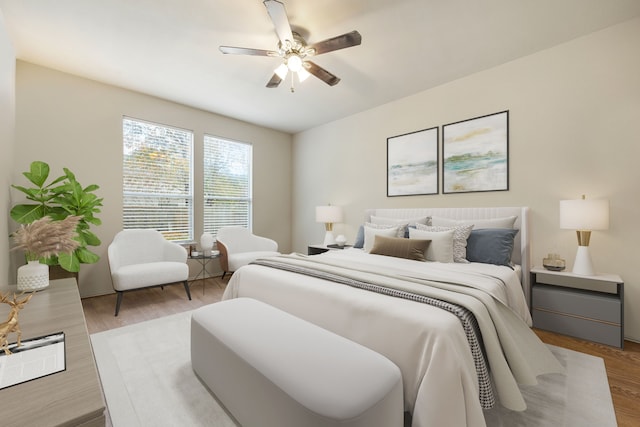 bedroom with light wood-type flooring and ceiling fan