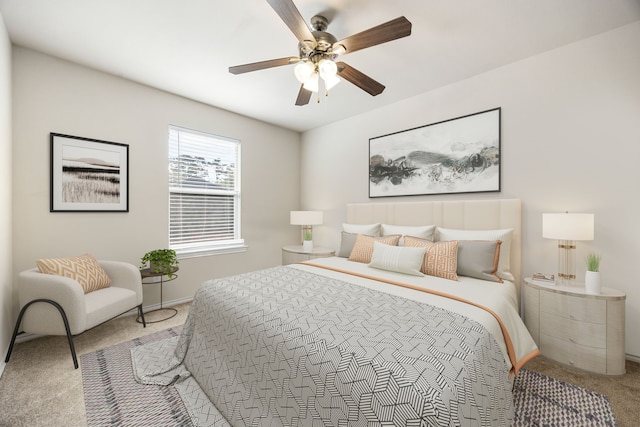 bedroom with light carpet and ceiling fan