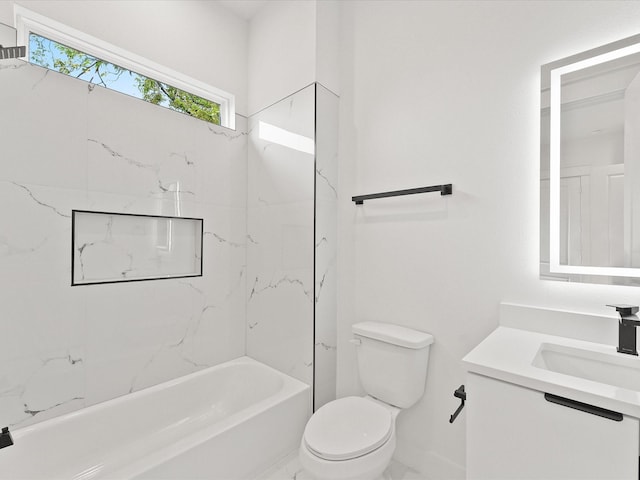 full bathroom with vanity, toilet, and tiled shower / bath