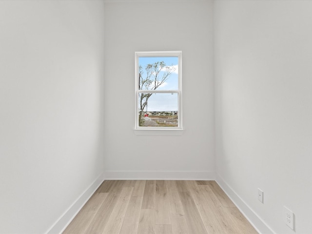 spare room with light wood-type flooring