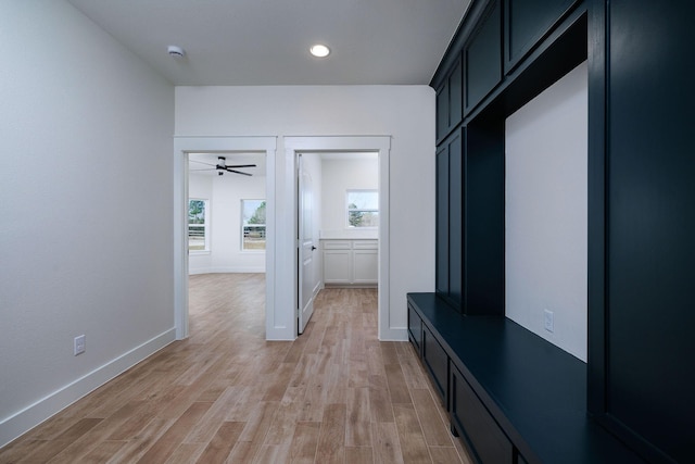 mudroom with ceiling fan and light hardwood / wood-style floors