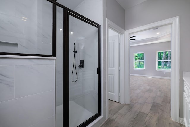 228 Feldspar Ln, Huntsville, TX 77340 - full bath featuring a shower stall, wood finished floors, and baseboards