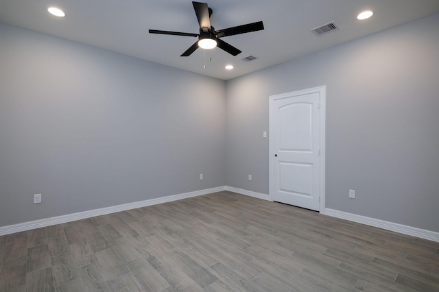 228 Feldspar Ln, Huntsville, TX 77340 - unfurnished room with a ceiling fan, wood finished floors, recessed lighting, and baseboards
