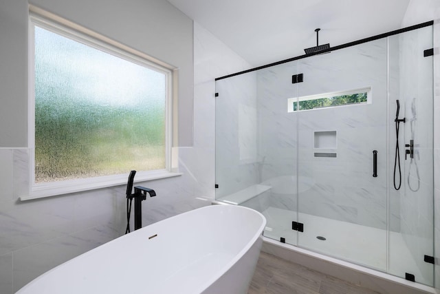 228 Feldspar Ln, Huntsville, TX 77340 - bathroom featuring a marble finish shower and a freestanding tub