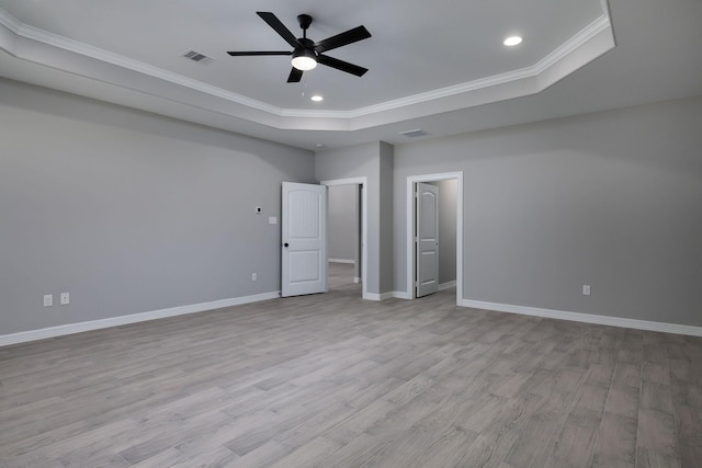 228 Feldspar Ln, Huntsville, TX 77340 - unfurnished bedroom with a raised ceiling, crown molding, light wood-type flooring, baseboards, and recessed lighting