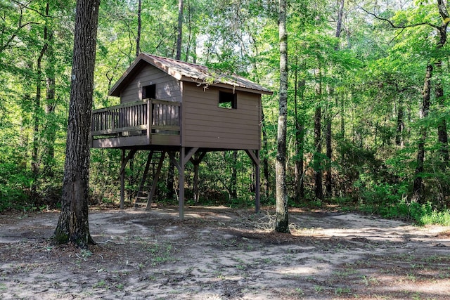 228 Feldspar Ln, Huntsville, TX 77340 - view of outdoor structure with a forest view