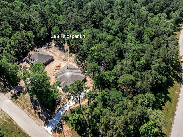 228 Feldspar Ln, Huntsville, TX 77340 - aerial view of property and surrounding area featuring a heavily wooded area