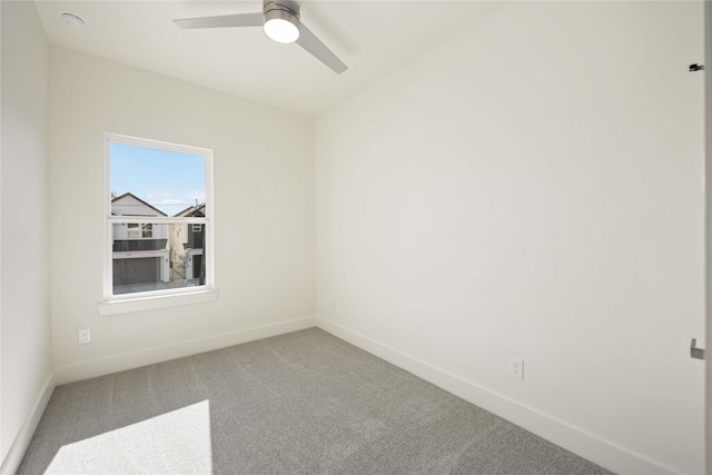 unfurnished room with ceiling fan and carpet floors