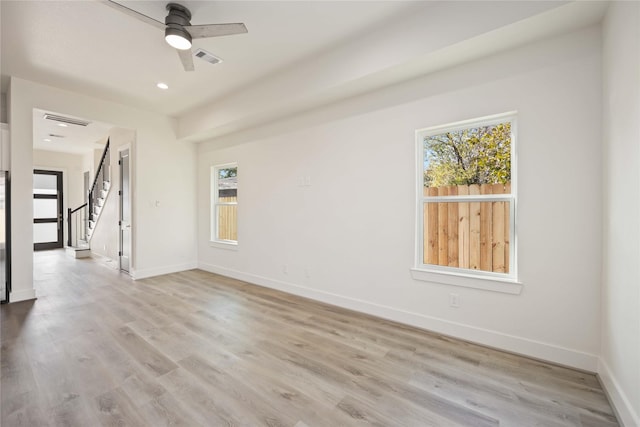 unfurnished room featuring light hardwood / wood-style floors and ceiling fan