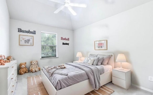 carpeted bedroom featuring vaulted ceiling and ceiling fan