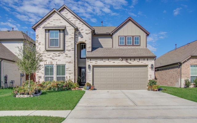 view of front of house featuring a garage and a front lawn