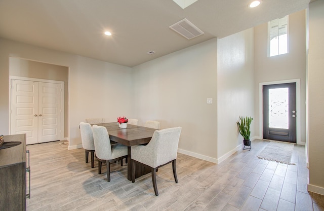 dining space with light wood-type flooring