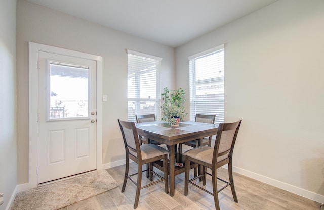 dining area with light wood-type flooring