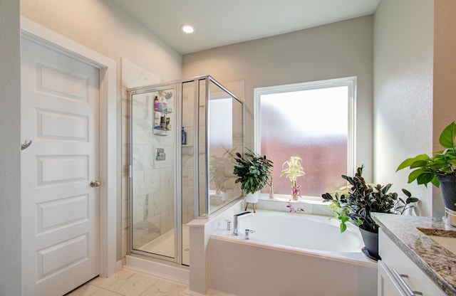 bathroom featuring vanity and plus walk in shower