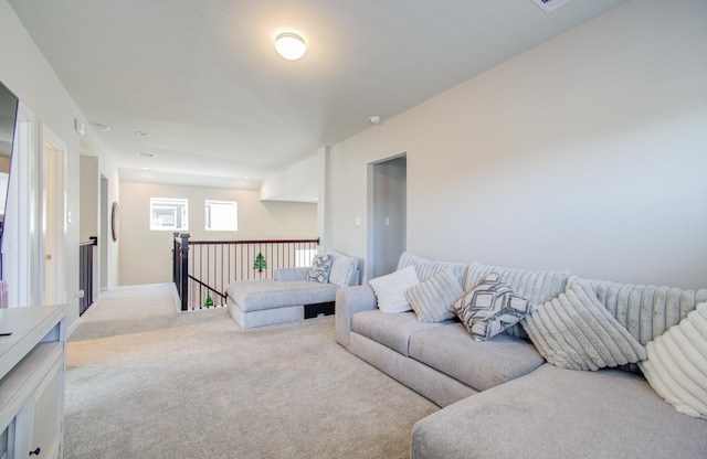 living room featuring light carpet