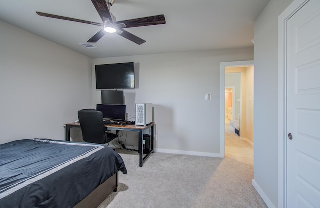 bedroom featuring light colored carpet and ceiling fan