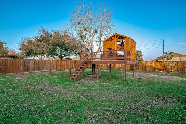 view of jungle gym featuring a lawn