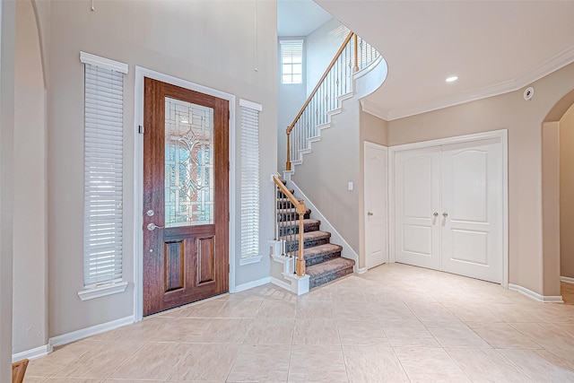 tiled entryway with ornamental molding