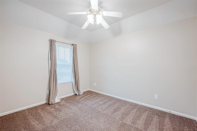 spare room featuring ceiling fan and carpet floors