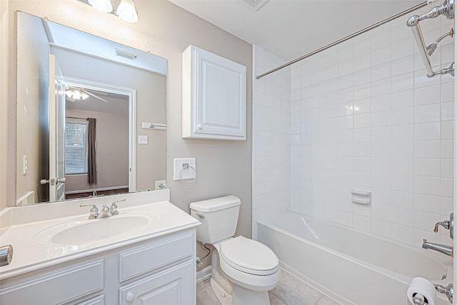 full bathroom featuring vanity, toilet, and tiled shower / bath