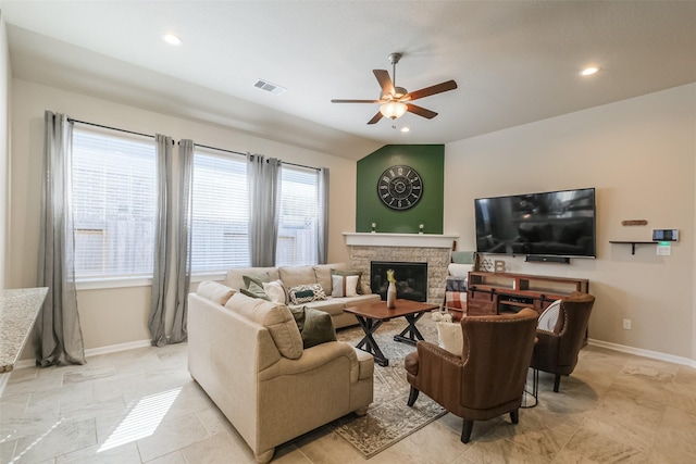 29614 Sterling Knoll Dr, Fulshear, TX 77441 - living room with visible vents, baseboards, ceiling fan, and a fireplace