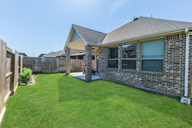 29614 Sterling Knoll Dr, Fulshear, TX 77441 - back of house with a fenced backyard, a patio, a yard, and brick siding