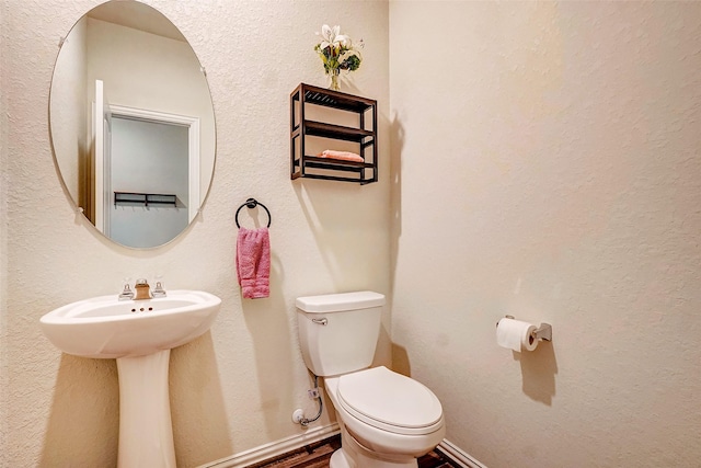 bathroom featuring toilet