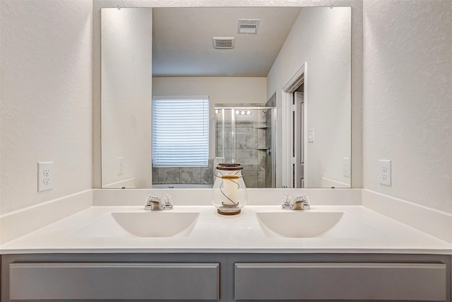 bathroom featuring vanity and independent shower and bath