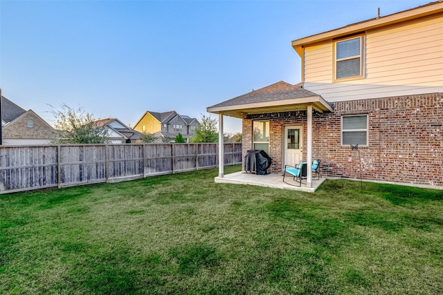 view of yard featuring a patio area and a fenced backyard