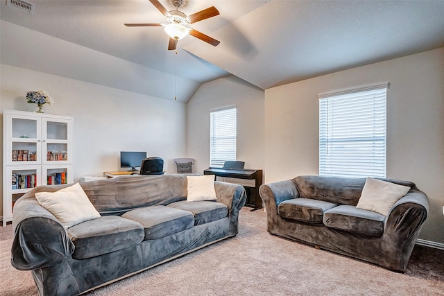 carpeted living room featuring ceiling fan and lofted ceiling