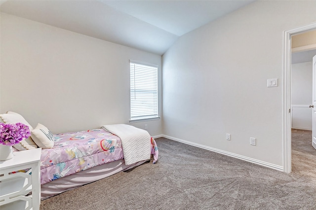 bedroom featuring carpet floors, baseboards, and vaulted ceiling