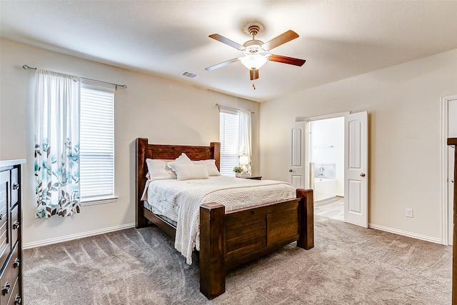 bedroom with carpet floors, baseboards, and visible vents