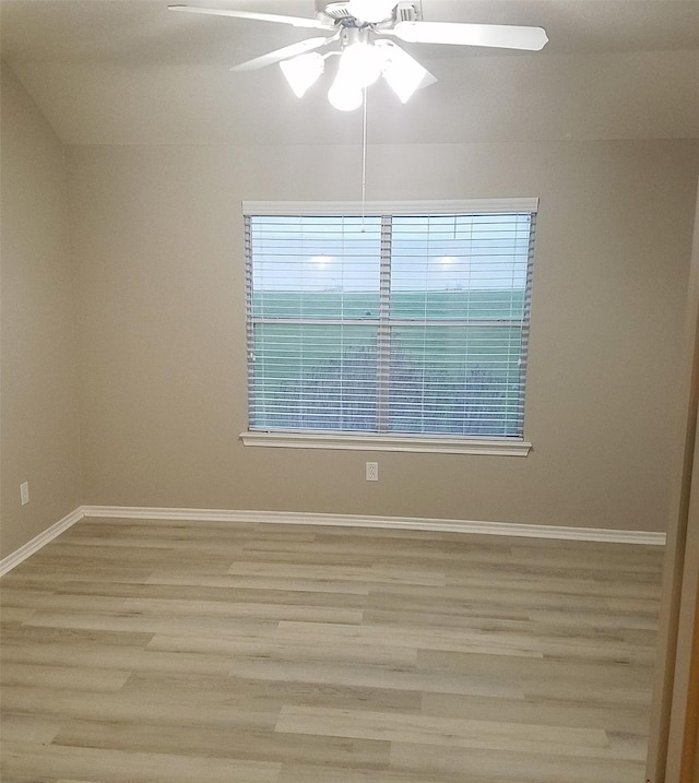 empty room with light hardwood / wood-style floors and ceiling fan