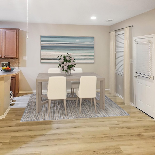 dining area with light wood-type flooring