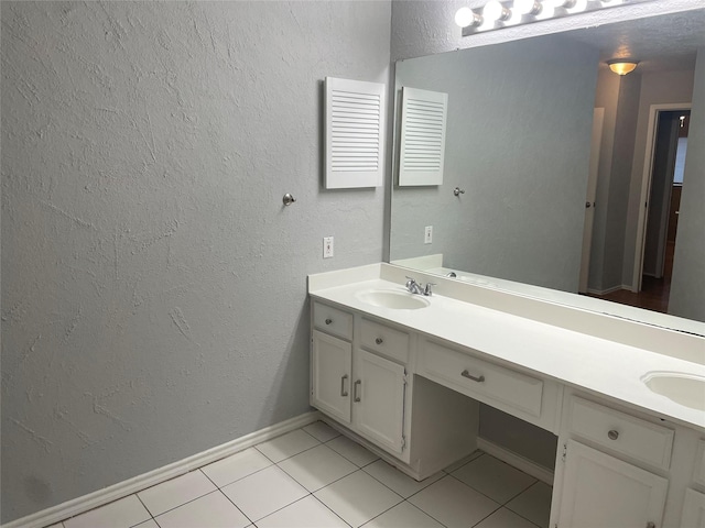 bathroom featuring tile patterned flooring and vanity