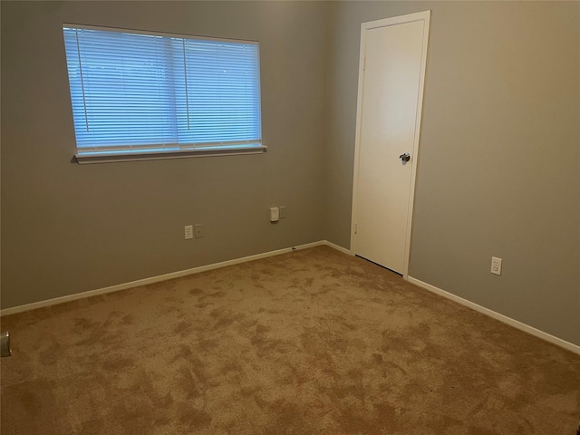 empty room featuring carpet floors