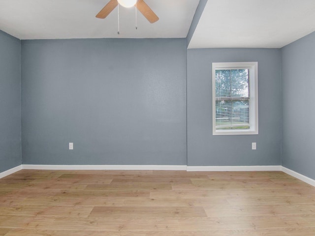 empty room featuring light hardwood / wood-style flooring and ceiling fan