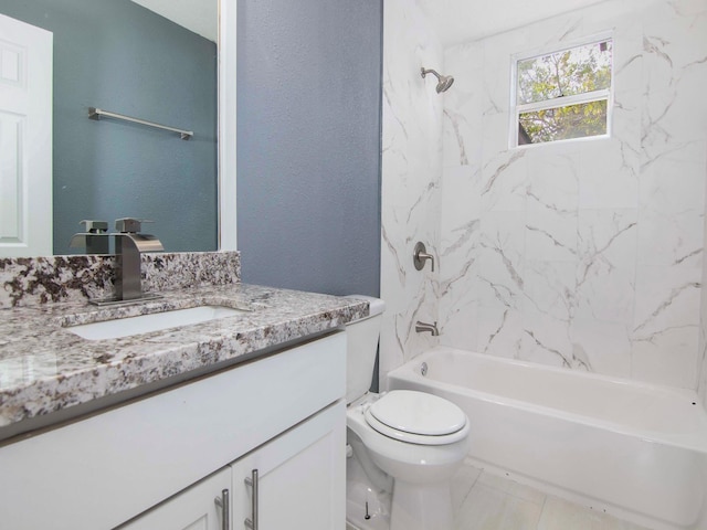 full bathroom with vanity, toilet, and tiled shower / bath