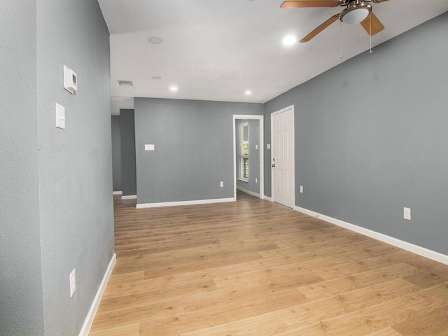 unfurnished room with light hardwood / wood-style floors and ceiling fan