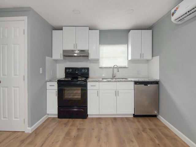 kitchen with dishwasher, sink, black range with electric cooktop, a wall mounted AC, and white cabinets