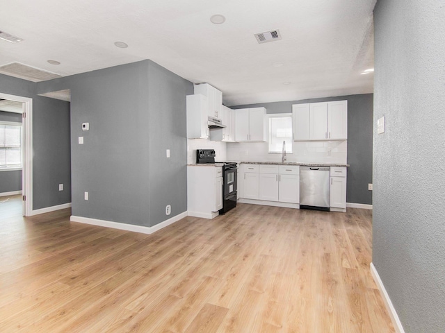 kitchen featuring dishwasher, a healthy amount of sunlight, white cabinets, electric range, and light hardwood / wood-style floors