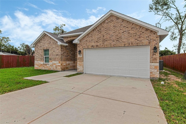 view of front facade featuring a garage and a front lawn